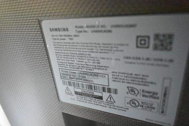 Samsung TV model UN55MU6290FXZA label on back panel detailing specifications and serial number. Includes UL certification.