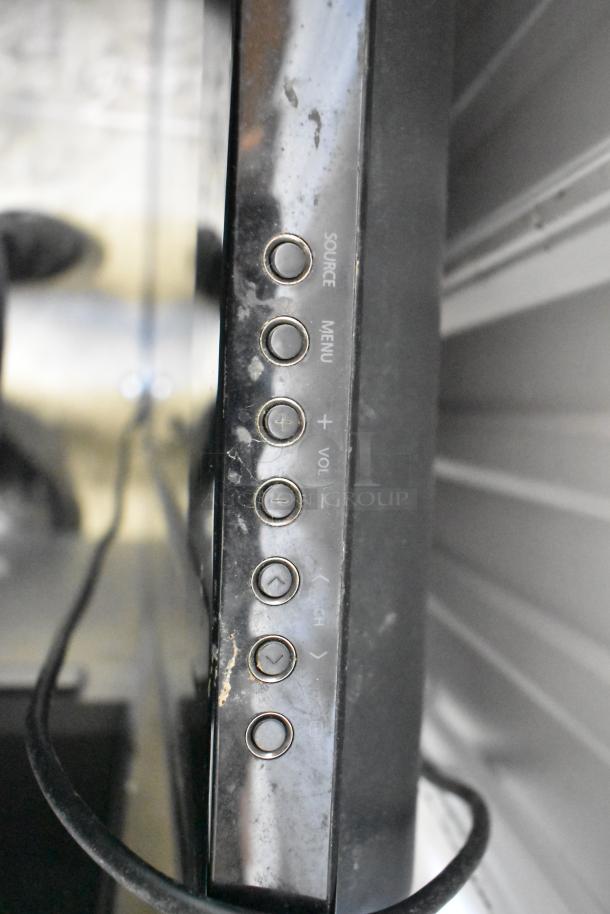 Samsung PN50A400C2DXZA 50" TV in used condition with control buttons visible. Buyer must pick up.