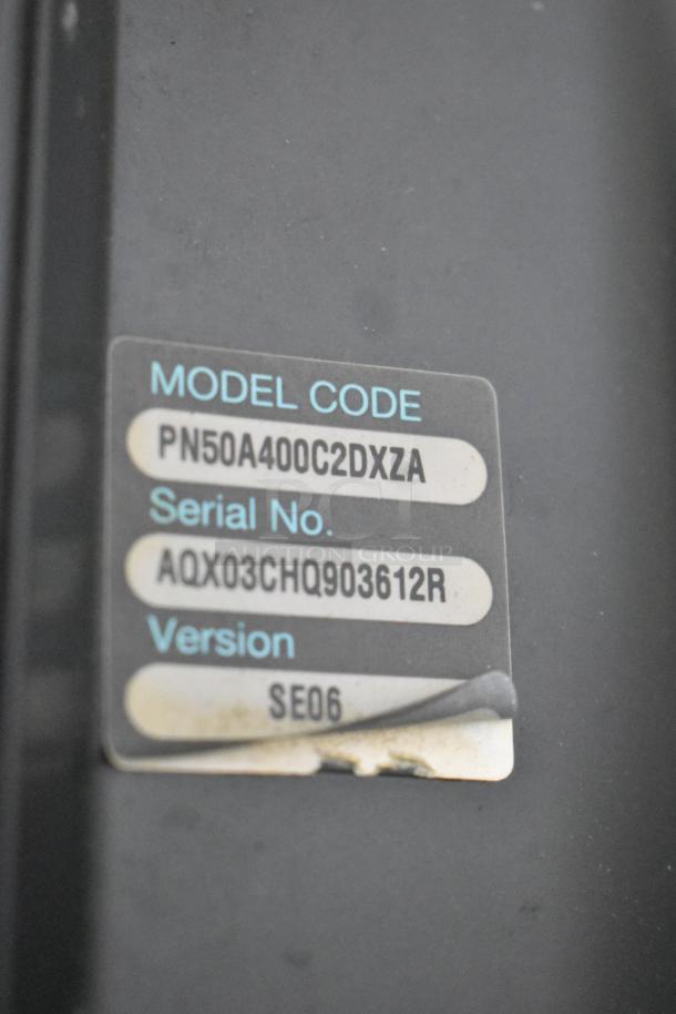 Samsung PN50A400C2DXZA 50" TV model label showing serial number AQX03CHQ903612R and version SE06. Pickup only.