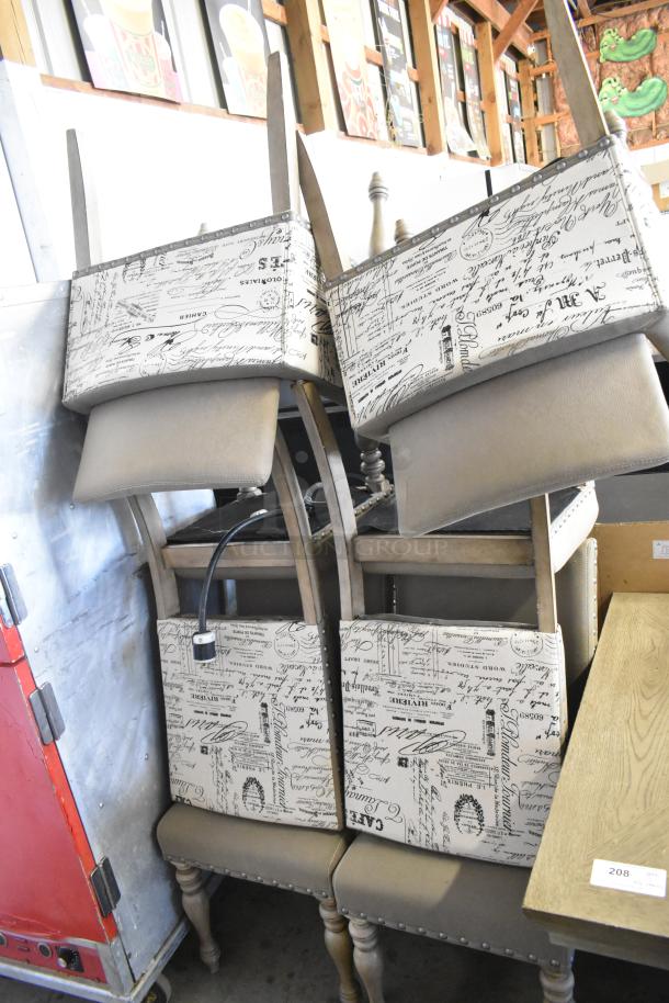 Wooden dining table with six chairs, featuring beige fabric backs with script pattern. Good condition, sturdy design.