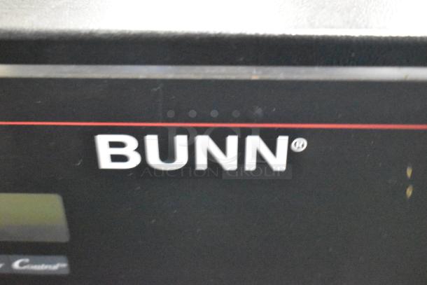 Bunn logo on a 2017 DUAL SH DBC stainless steel commercial coffee machine, featuring a hot water dispenser and satellite server.