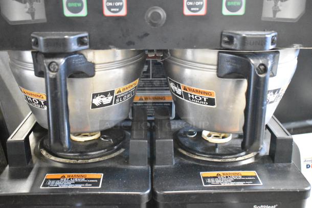 2016 Bunn DUAL SH DBC stainless steel coffee machine with two metal brew baskets and hot water dispenser. Warning labels visible.