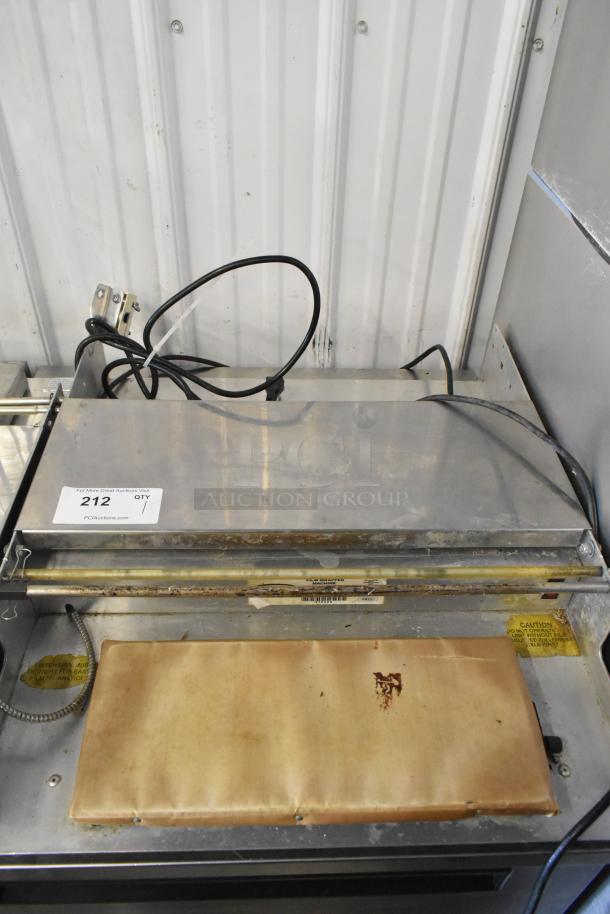 Win-holt WHSS-1 metal countertop film wrapper machine, used condition, 120 volts, 1 phase, visible wires and wear marks.