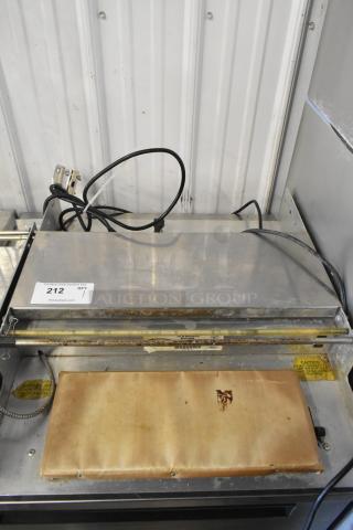 Win-holt WHSS-1 metal countertop film wrapper machine, used condition, 120 volts, 1 phase, visible wires and wear marks.