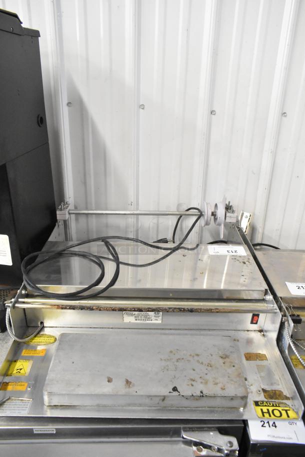 Win-holt WHSS-1 Metal Countertop Film Wrapper Machine, 120V, 1 Phase. Visible wear, safety labels attached, power cord included.