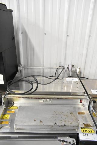 Win-holt WHSS-1 Metal Countertop Film Wrapper Machine, 120V, 1 Phase. Visible wear, safety labels attached, power cord included.
