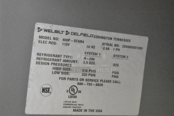 2022 Delfield 406P-STAR4 stainless steel undercounter cooler label showing model, 115V elec. requirement, and NSF certification.