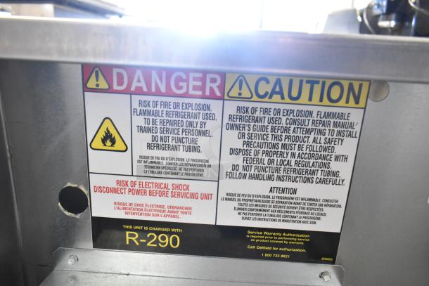 Warning label on Delfield 406P-STAR4 undercounter cooler; indicates flammable refrigerant R-290 and electrical shock risk.