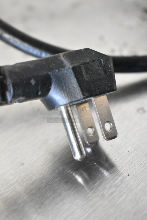Power plug for Traulsen UHT27L0-0300 stainless steel commercial cooler, 115V, 1 phase, black and metallic finish.