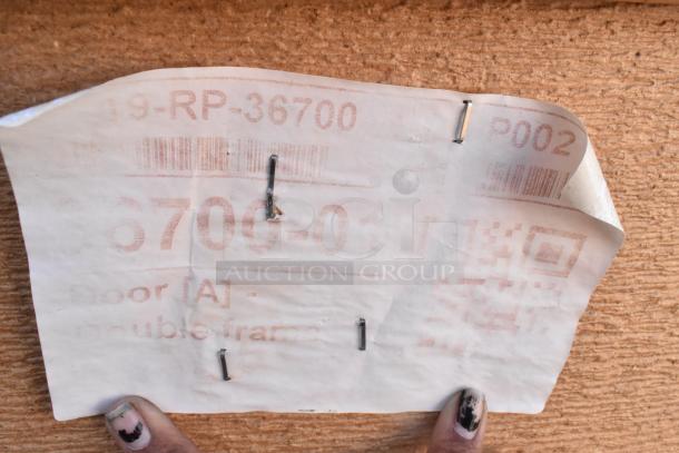 New 36"x84" door with minor scratches and dents. Visible label: "Door [A] - double frame."