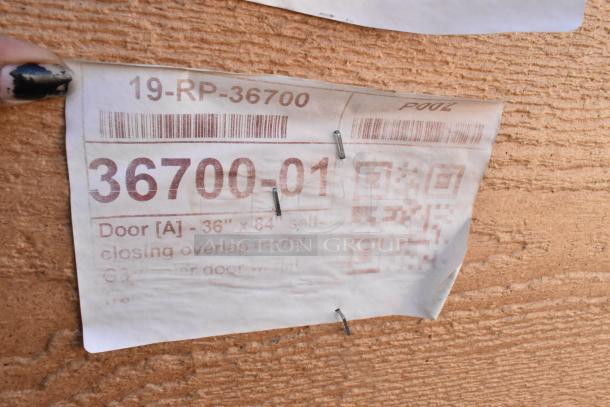 Label for 36"x84" door with model 36700-01, indicating a scratch and dent condition.