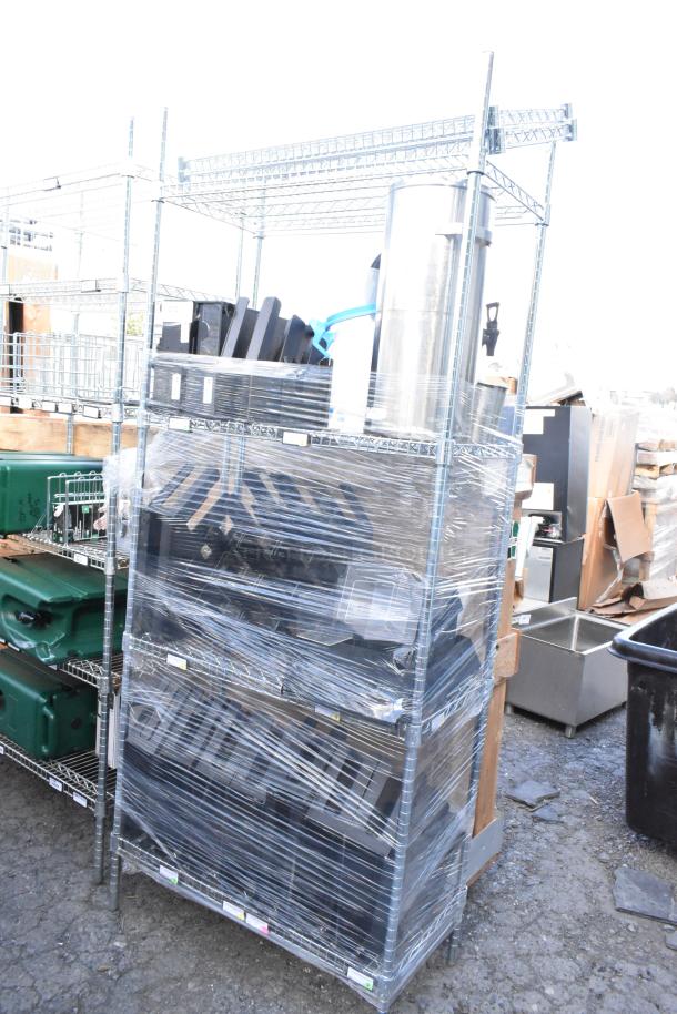 Chrome finish 4-tier wire shelving unit with contents, wrapped for transport. Buyer must dismantle. Freight charges apply.