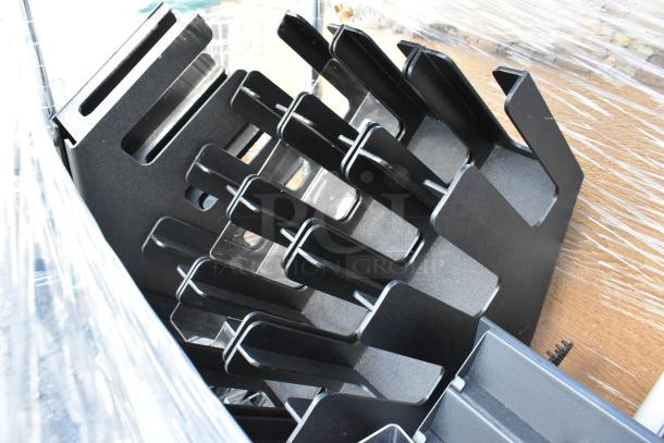 Chrome finish 4-tier wire shelving unit with contents. Includes black metal parts, wrapped for shipping. Buyer must dismantle.