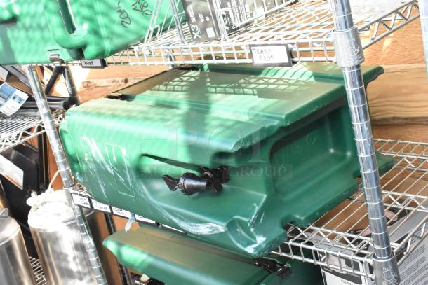 Chrome finish 6-tier wire shelving unit with green poly insulated beverage holder dispensers. Buyer must dismantle.