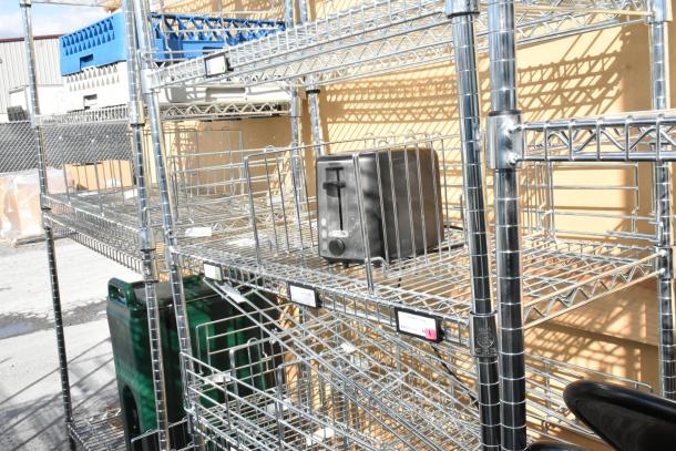 Chrome finish 6-tier wire shelving unit with contents, including a toaster. Buyer must dismantle. Consider freight charges.