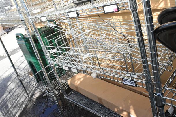 Chrome finish 6-tier wire shelving unit with contents, buyer must dismantle, suitable for freight shipping, labeled sections.