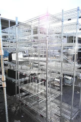 Chrome finish 6 tier wire shelving unit with contents, undismantled, for auction. Buyer responsible for dismantling and freight.
