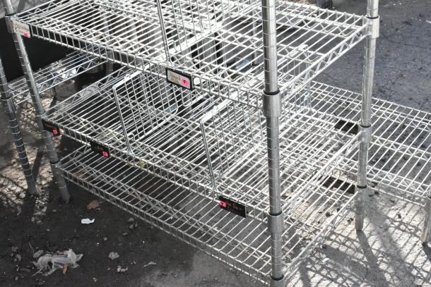 Chrome finish 6-tier wire shelving unit with contents. Buyer must dismantle. Tags show organization and pricing details.