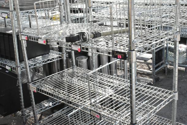 Chrome finish 6-tier wire shelving unit with contents, visible labels and equipment; buyer must dismantle for shipping.