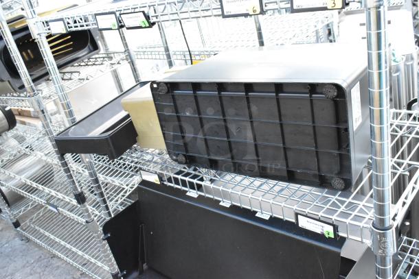 Chrome finish 4-tier wire shelving unit with metal baking pans. Buyer to dismantle. Consider freight charges.