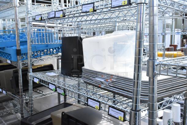 Chrome 4-tier wire shelving unit with metal baking pans. Includes contents. Buyer must dismantle. Consider freight charges.