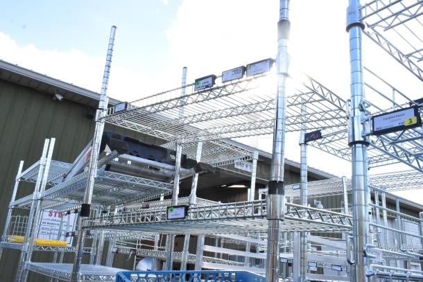 Chrome finish 6-tier wire shelving unit with attached poly beverage dispensers. Buyer must dismantle. Consider freight charges.