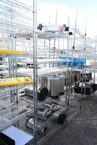 Chrome finish 6-tier wire shelving unit with corny kegs, various items. Buyer must dismantle. Consider freight charges.