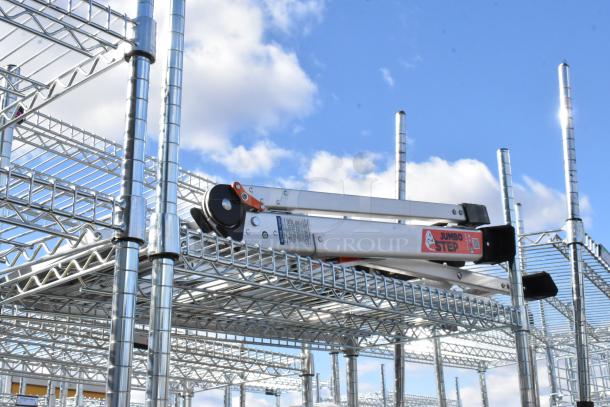 Chrome finish 6-tier wire shelving unit with contents including corny kegs. Buyer must dismantle. Consider freight charges.