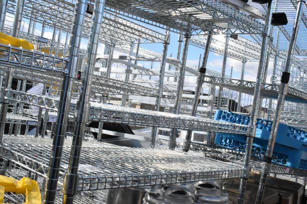 Chrome finish 6-tier wire shelving unit with contents, including Corny kegs. Dismantling required. Freight charges apply.