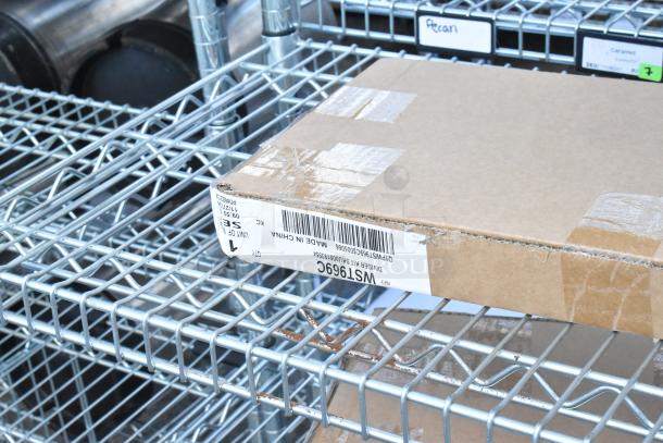 Chrome finish 6 tier wire shelving unit holding WST969C divider in a cardboard box. Shelving in used condition.