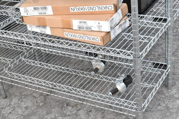 Chrome finish 6-tier wire shelving unit with contents, including WST969C divider, shown with packaging labels visible.