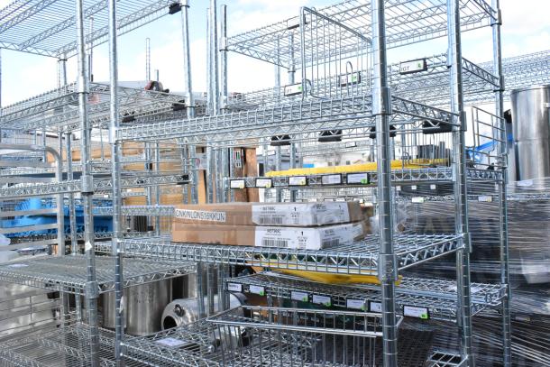 Chrome finish 6-tier wire shelving unit with WST969C divider, including contents. Buyer must dismantle. Consider freight.