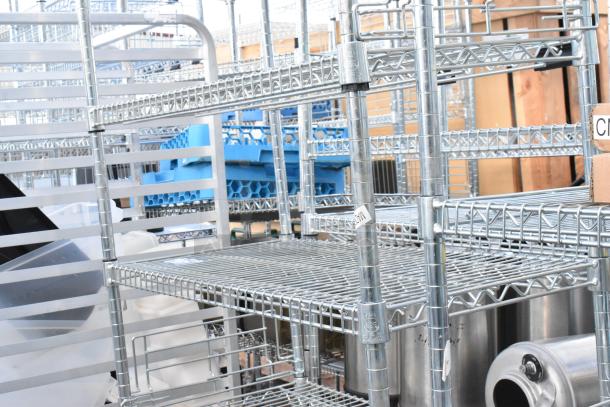 Chrome finish 8-tier wire shelving unit, sturdy condition, includes contents. Buyer to dismantle. Consider freight charges.