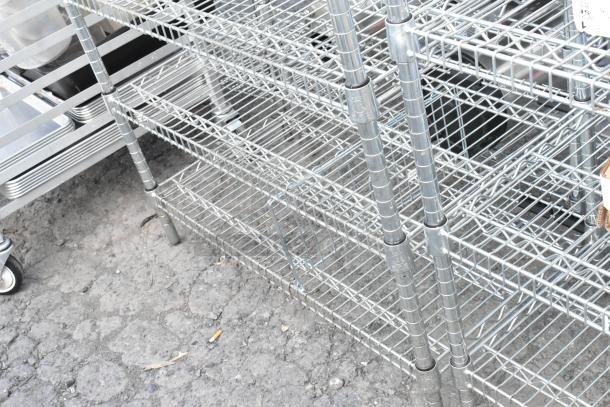 Chrome finish 8-tier wire shelving unit with contents, durable design, buyer must dismantle, freight charges apply.