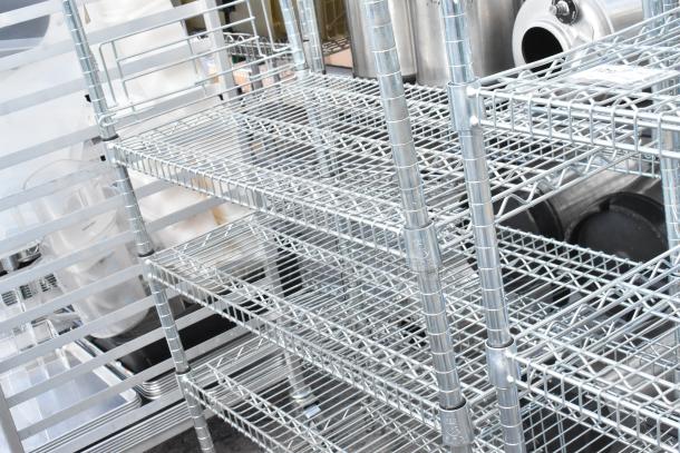 Chrome finish 8-tier wire shelving unit with contents. Good condition. Buyer must dismantle. Consider freight charges.