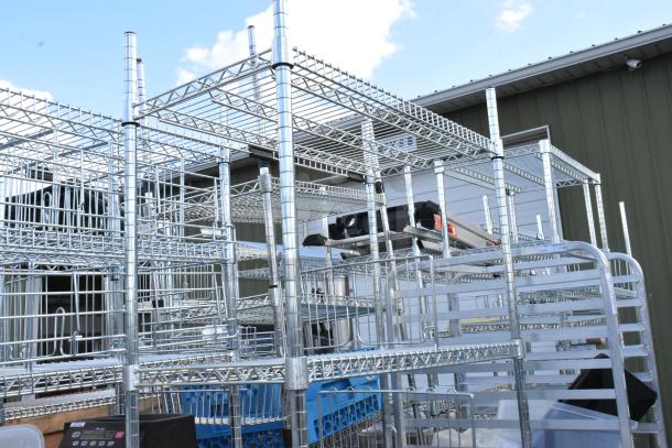 Chrome finish 6-tier wire shelving unit, requires dismantling. Ideal for storage, sturdy construction, freight charges apply.