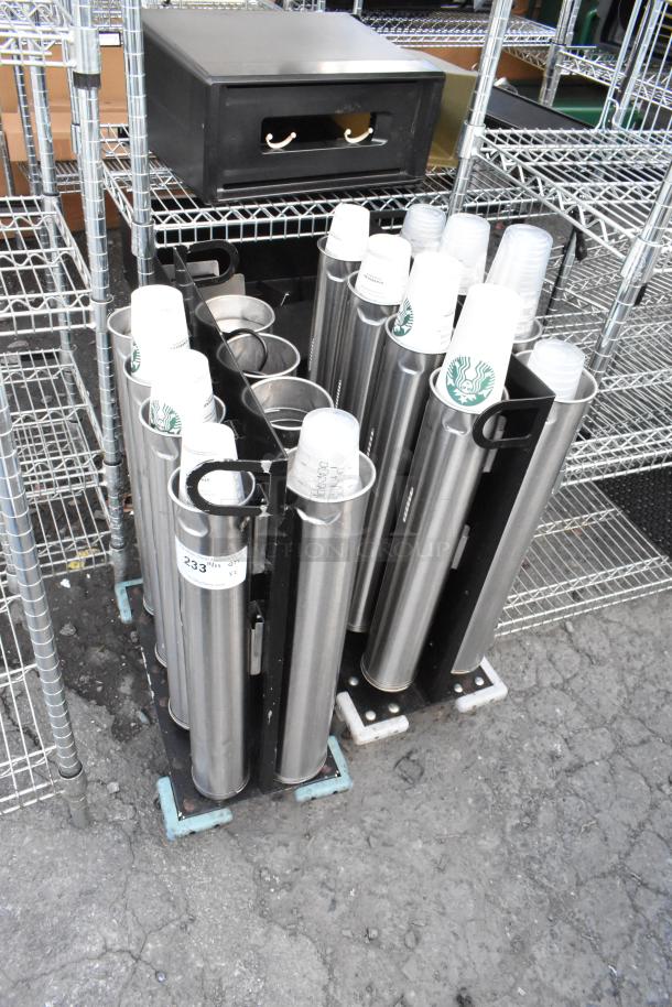 Two metal carts with eight stainless steel cup dispensers, each with logo cups; good condition, auction item tag visible.