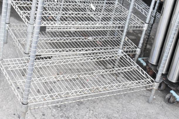 Chrome finish 6-tier wire shelving unit. Good condition. Buyer must dismantle. Consider freight charges for shipping.