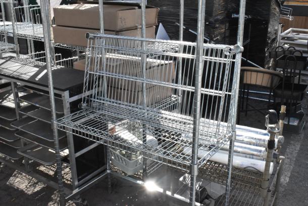 Chrome finish 4 tier wire shelving unit in used condition. Buyer must dismantle. Consider freight charges for shipping.