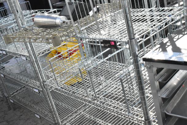 Chrome finish 6-tier wire shelving unit, excellent condition. Buyer must dismantle. Freight charges apply.