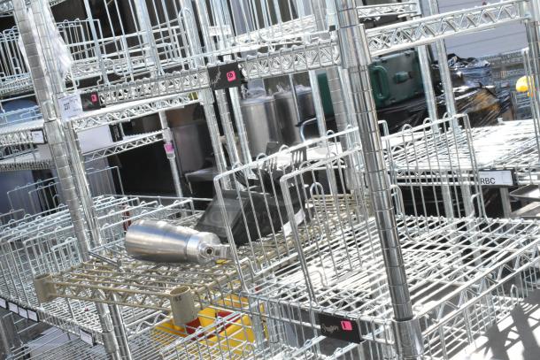 Chrome finish 6-tier wire shelving unit, durable, spacious, dismantle required, freight charges considered.