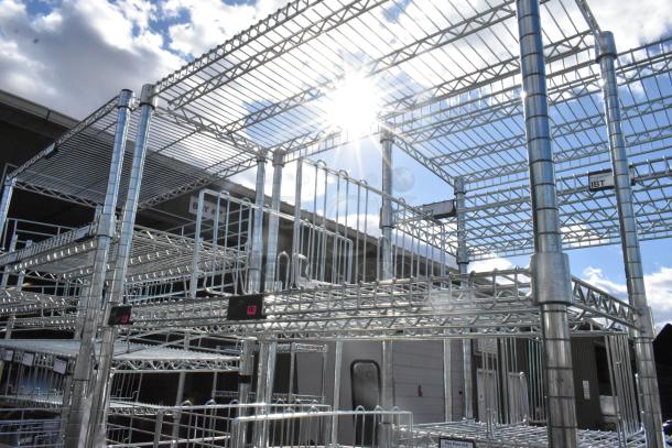 Chrome finish 6-tier wire shelving unit, sturdy construction, tags visible, buyer dismantle required, consider freight.