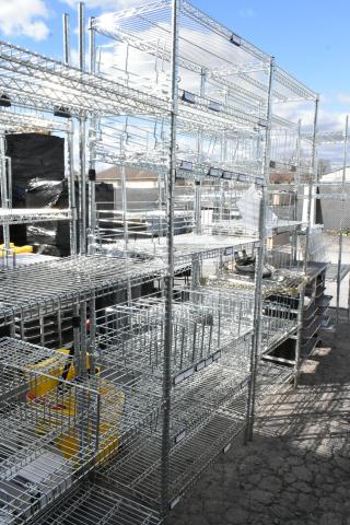 Chrome finish 5-tier wire shelving unit, in excellent condition. Buyer must dismantle; consider freight charges.