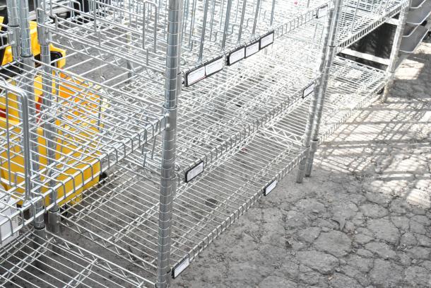 Chrome finish 5 tier wire shelving unit in good condition. Includes labeling tags. Buyer must dismantle for shipping.