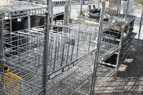 Chrome finish 5-tier wire shelving unit in good condition. Includes labeling. Buyer must dismantle for shipping.