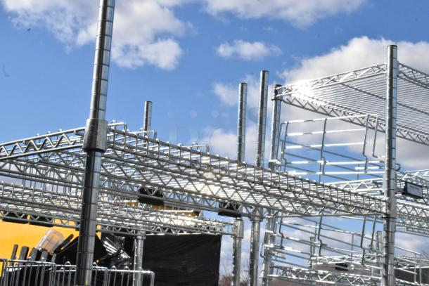 Chrome finish 4-tier wire shelving unit, sturdy construction, suitable for storage, dismantling required, freight charges apply.