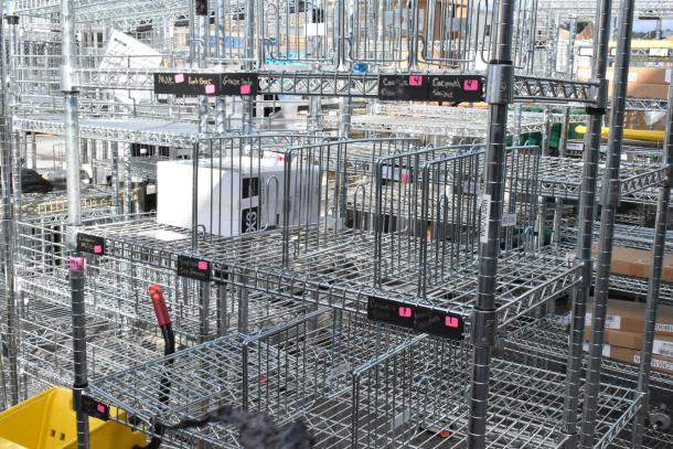 Chrome finish 6-tier wire shelving unit in excellent condition, featuring labeled organization sections. Buyer must dismantle.