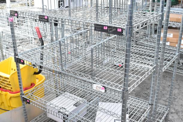 Chrome finish 6-tier wire shelving unit, excellent condition, with visible labels. Buyer must dismantle for shipping.