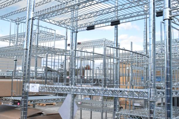 Chrome finish 6 tier wire shelving unit, sturdy construction, visible tags require buyer to dismantle. Ideal for storage.