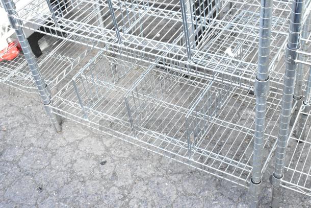 Chrome finish 6-tier wire shelving unit in good condition, requires dismantling for shipping. Potential freight charges apply.